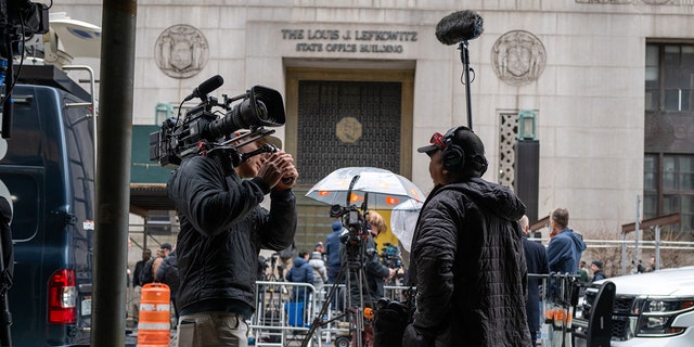 Members of the media gather outside of New York County Criminal Courthouse as the nation waits for the possibility of an indictment against former President Donald Trump on March 27, 2023.