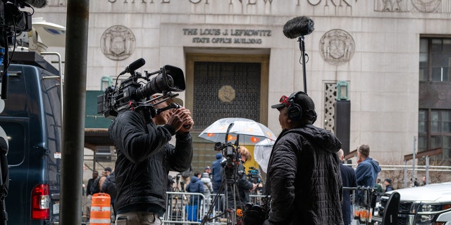 Media gather outside of New York County Criminal Courthouse as the nation waits for the possibility of an indictment against former president Donald Trump by the Manhattan District Attorney Alvin Bragg's office on March 27, 2023, in New York City.