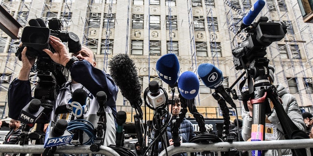 Media members outside criminal court near the office of Manhattan District Attorney Alvin Bragg in New York, on Monday, March 27, 2023.