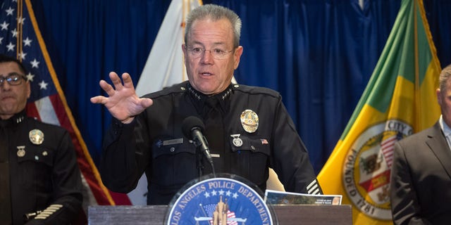 LAPD Chief Michel Moore speaks from podium