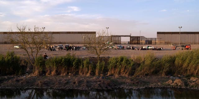 Migrants wait to be processed by United States Border Patrol seen from Ciudad Juarez, Chihuahua state, Mexico.