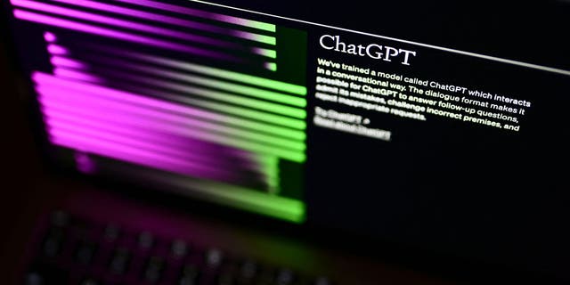 A computer screen depicts OpenAI's website, displaying its ChatGPT software.  