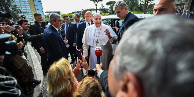 Pope Francis addresses the media as he leaves the Gemelli hospital on April 1, 2023, in Rome, after being discharged following treatment for bronchitis.