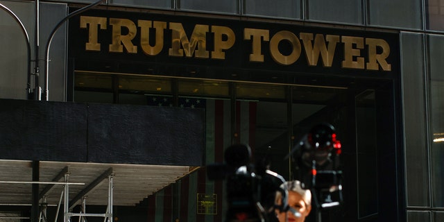 Members of the media stand outside Trump Tower on April 1, 2023, in New York City. Trump is expected to be arraigned in New York City this week.