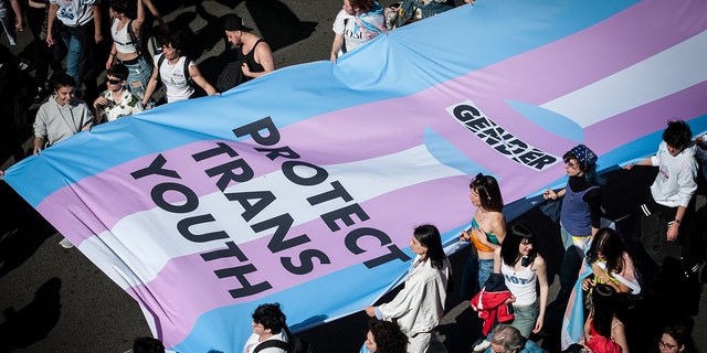 People take part in a rally on the occasion of the International Transgender Day of Visibility in the city center of Rome, Italy, 01 April 2023. Trans Visibility Day is an annual event, observed on 31 March.