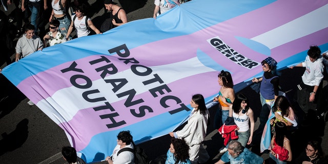 People take part in a rally on the occasion of the International Transgender Day of Visibility in the city center of Rome, Italy, 01 April 2023. Trans Visibility Day is an annual event, observed on 31 March.