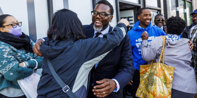 Chicago mayoral candidate Brandon Johnson hugs Rhoda Rae Gutierrez at campaign stop at 6th Ward aldermanic candidate William Hall&amp;apos;s office Sunday, April 2, 2023. (Armando L. Sanchez/Chicago Tribune/Tribune News Service via Getty Images)