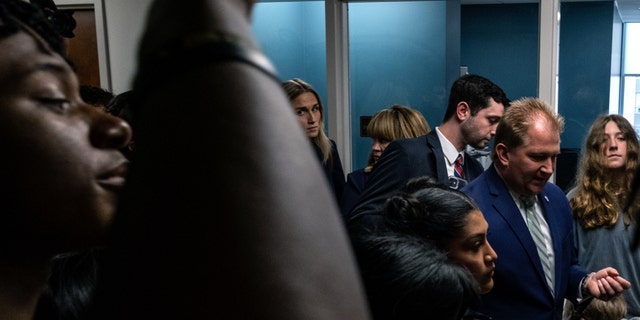 Republican Representative William Lamberth, R., speaks with students inside Cordell Hall in Nashville after students walked out of schools to gather at the Tennessee State Capitol building in protest to demand action for gun reform laws in the state.