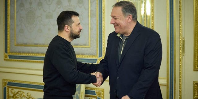  Ukrainian President Volodymyr Zelenskyy shakes hands with former Secretary of State Mike Pompeo in Kyiv on April 4, 2023.