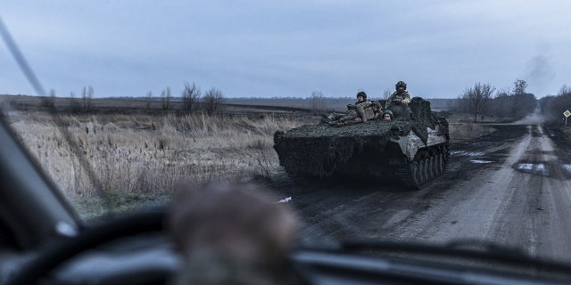 Soldiers on a BMP move near Chasiv Yar, Donetsk oblast, on April 4, 2023.