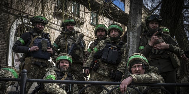Ukrainian soldiers pose amid Russia-Ukraine war on the frontline of Donetsk Oblast, Ukraine on March 29, 2023. 