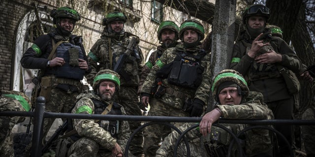 Ukrainian soldiers pose amid Russia-Ukraine war on the frontline of Donetsk Oblast, Ukraine on March 29, 2023. 