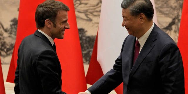 Chinas President Xi Jinping shakes hands with his French counterpart, Emmanuel Macron, in Beijing on April 6, 2023.