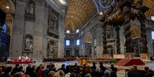 Pope Francis (Rear L on platform) presides over the Passion of the Lord mass on Good Friday at St. Peter's basilica in The Vatican as part of celebrations of the Holy Week. 