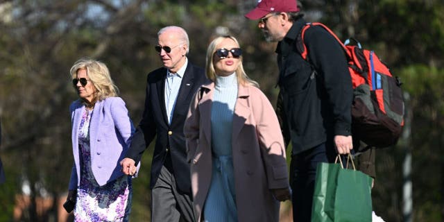 US President Joe Biden, First Lady Jill Biden, Hunter Biden, and his wife Melissa Cohen walk to the motorcade after arriving on Marine One at Fort McNair in Washington, D>C., on April 9, 2023.