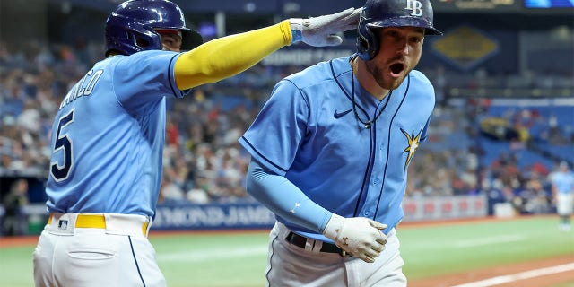 Brandon Lowe of the Tampa Bay Rays celebrates his home run against the Boston Red Sox at Tropicana Field on April 10, 2023, in St. Petersburg.