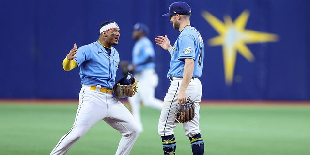 Wander Franco of the Tampa Bay Rays, left, celebrates a win over the Boston Red Sox with Brandon Lowe on April 10, 2023, in St. Petersburg, Florida.