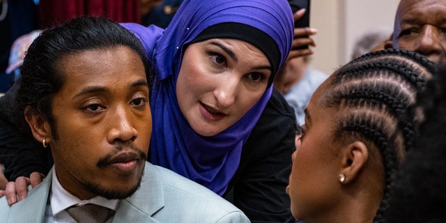 State Rep. Justin Jones listens as Linda Sarsour speaks before Jones is reinstated to his seat in municipal court on April 10, 2023, in Nashville, Tennessee.