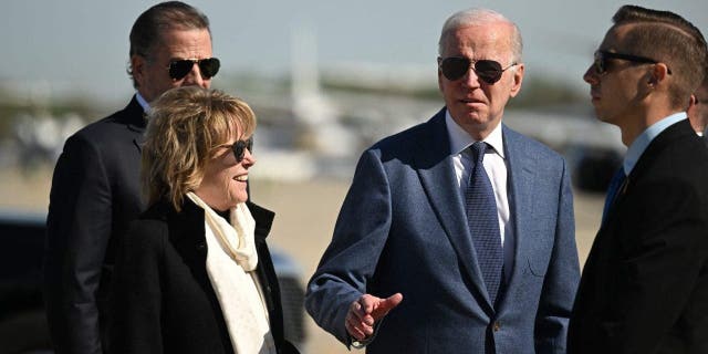 US President Joe Biden, with his sister Valerie Biden (2nd L), and son Hunter Biden (L), arrives to board Air Force One, as he departs for Northern Ireland, at Joint Base Andrews in Maryland on April 11, 2023.
