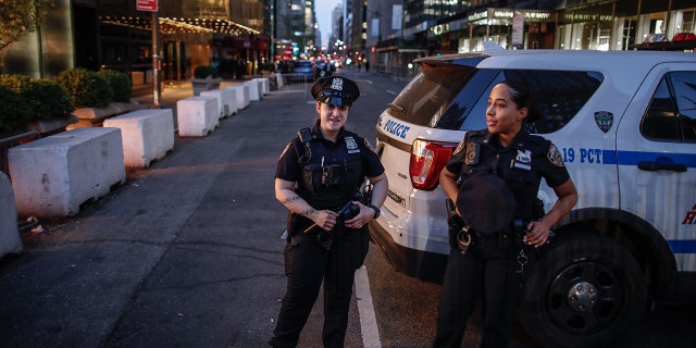 NYPD Officers guard outside Trump Tower in New York on April 12, 2023 as former US President Donald Trump who is scheduled to return to New York City.