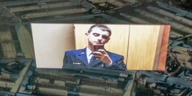 Jack Teixeira, seen reflected in an image of the Pentagon in Washington, DC, was arrested for allegedly being behind a major leak of sensitive US government secrets -- including about the Ukraine war. 