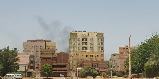 Smoke rises after clashes erupted in the Sudanese capital on April 15, 2023 between the Sudanese Armed Forces and the paramilitary Rapid Support Forces (RSF). 