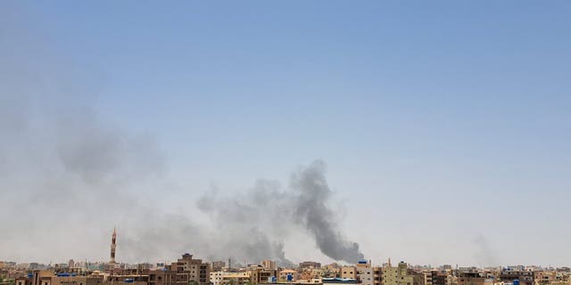 smoke rising out of sudan landscape
