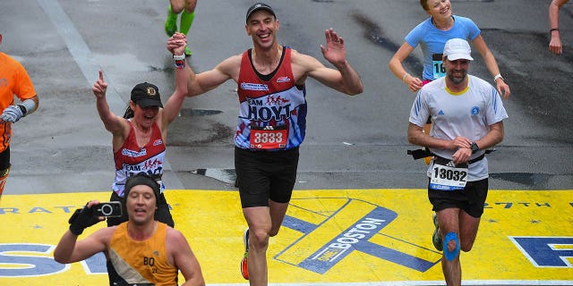 Zdeno Chara crosses the finish line at the Boston marathon