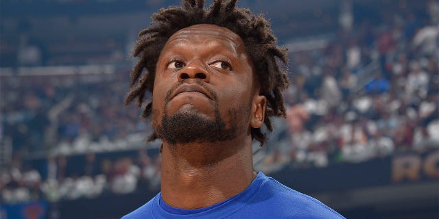 Julius Randle looks on before a playoff game