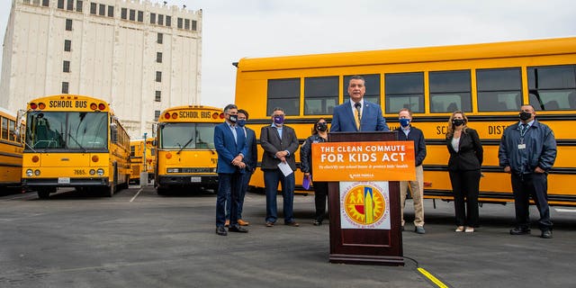 Sen. Alex Padilla, D-Calif., and Rep. Tony Cárdenas, D-Calif., hold a press conference about the electrification of busses in Los Angeles in May 2021. The two California Democrats, like Newsom, have pushed legislation that would invest $25 billion to replace diesel buses with electric buses.