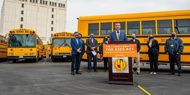 Sen. Alex Padilla, D-Calif., and Rep. Tony Cárdenas, D-Calif., hold a press conference about the electrification of busses in Los Angeles in May 2021. The two California Democrats, like Newsom, have pushed legislation that would invest $25 billion to replace diesel buses with electric buses.