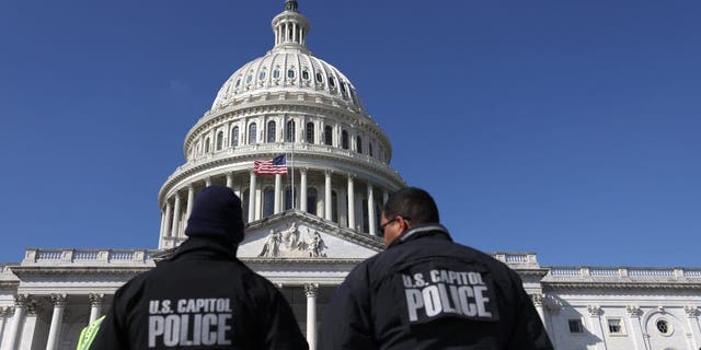 U.S. Capitol police officers gather on the east front plaza of the Capitol on Feb. 28, 2022, in Washington, D.C.