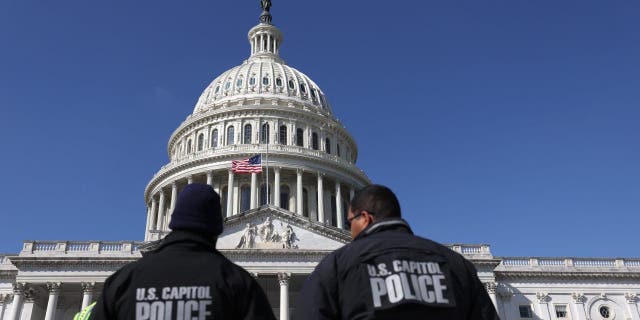 U.S. Capitol police officers gather on the east front plaza of the Capitol on Feb. 28, 2022, in Washington, D.C.