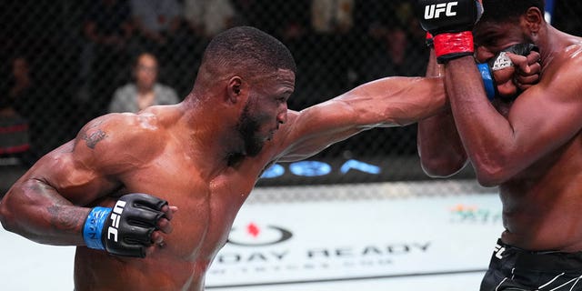(L-R) Karl Roberson punches Kennedy Nzechukwu of Nigeria in their light heavyweight fight during the UFC Fight Night event at UFC APEX on July 09, 2022 in Las Vegas, Nevada.