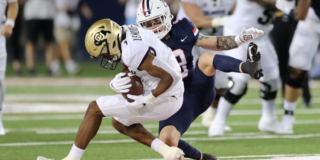 Montana Lemonious-Craig is tackled with the ball