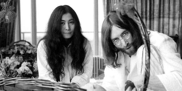 Yoko Ono and John Lennon at their "Bed-In for Peace" taken at the Hilton Hotel in Amsterdam, March 26, 1969. They were married six days earlier. 