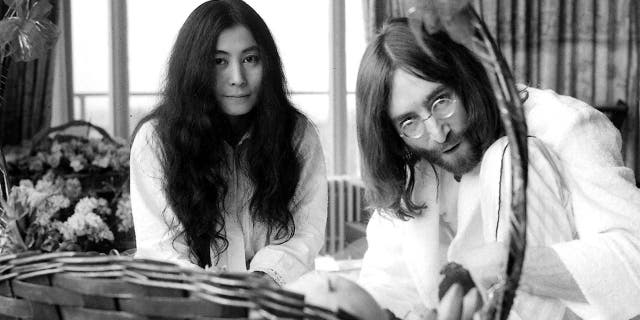 Yoko Ono and John Lennon at their "Bed-In for Peace" taken at the Hilton Hotel in Amsterdam, March 26, 1969. They were married six days earlier. 