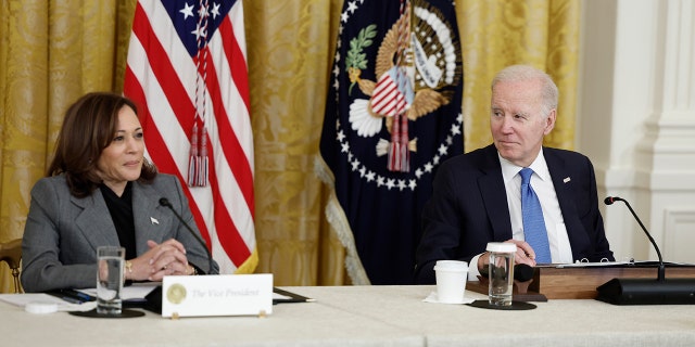 Biden and Harris sitting at a table together