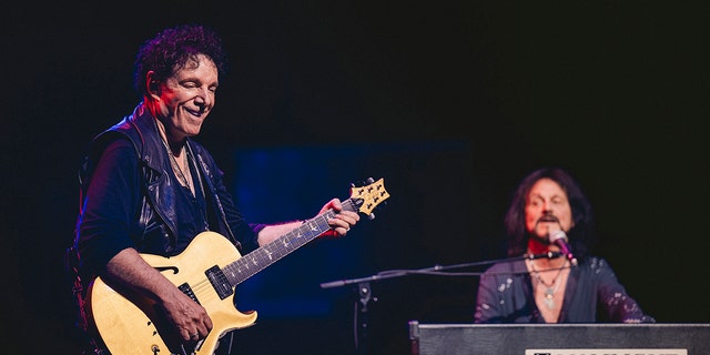 Neal Schon and Gregg Rolie on stage for Journey's 50th anniversary tour