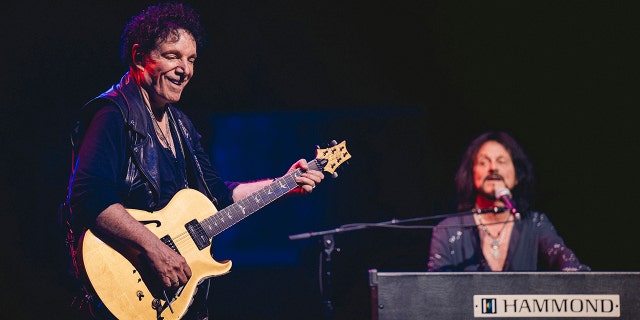 Neal Schon and Gregg Rolie on stage for Journey's 50th anniversary tour