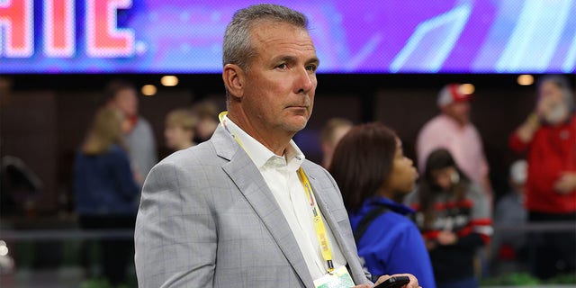 Urban Meyer looks on during the first round game of the NCAA Men's Basketball Tournament between the West Virginia Mountaineers and the Maryland Terrapins at Legacy Arena at the BJCC on March 16, 2023, in Birmingham, Alabama. 