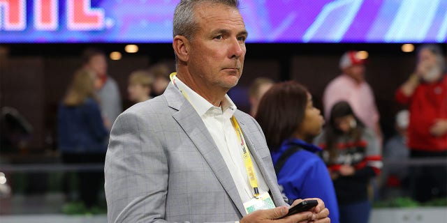 Urban Meyer looks on during the NCAA Men's Basketball Tournament first round game between the West Virginia Mountaineers and the Maryland Terrapins at Legacy Arena at the BJCC on March 16, 2023 in Birmingham, Alabama. 