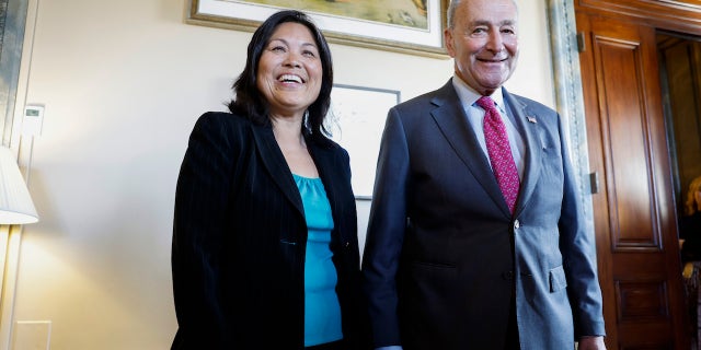 Senate Majority Leader Chuck Schumer poses for a photo with Su on March 28.