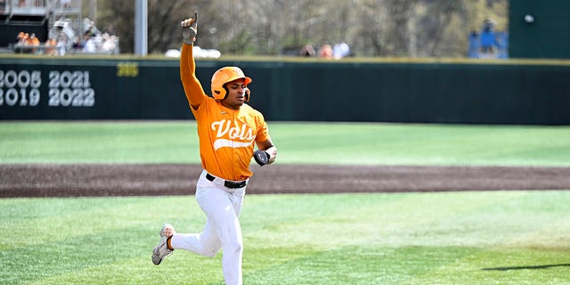 Christian Moore celebrates scoring a winning run