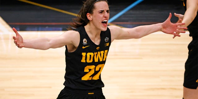 Caitlin Clark, #22, of the Iowa Hawkeyes celebrates after the Hawkeyes beat the South Carolina Gamecocks 77-73 during the 2023 NCAA Women's Basketball Tournament Final Four semifinal game at American Airlines Center on March 31, 2023, in Dallas, Texas. 