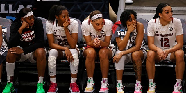 The South Carolina Gamecocks bench reacts in the final seconds of the fourth quarter against the Iowa Hawkeyes during the 2023 NCAA Tournament Final Four at the American Airlines Center on March 31, 2023, in Dallas, Texas. 