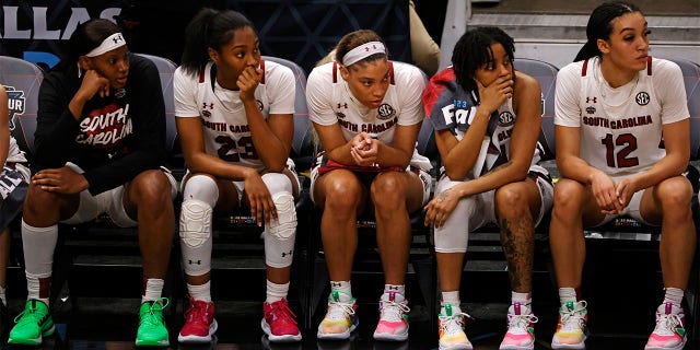 The South Carolina Gamecocks bench reacts in the closing seconds of the fourth quarter against the Iowa Hawkeyes during the 2023 NCAA Tournament Final Four at American Airlines Center March 31, 2023, in Dallas, Texas. 