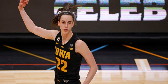 Caitlin Clark, #22 of the Iowa Hawkeyes, reacts after a three-point basket during the fourth quarter against the South Carolina Gamecocks during the 2023 NCAA Women's Basketball Tournament Final Four semifinal game at American Airlines Center on March 31, 2023, in Dallas, Texas.