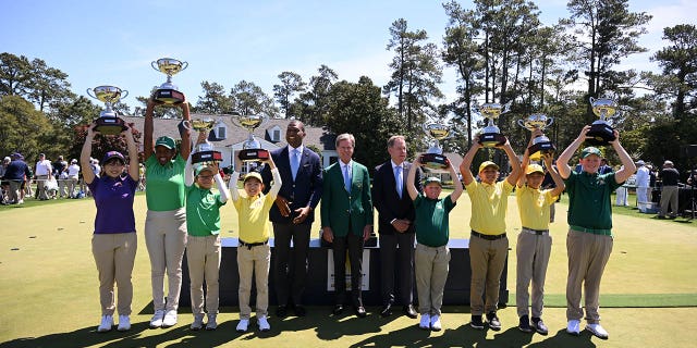 Fred Ridley, Chairman of Augusta National Golf Club, poses with the overall winners of the Drive, Chip and Putt Championship at Augusta National Golf Club at Augusta National Golf Club on April 02, 2023 in Augusta, Georgia.