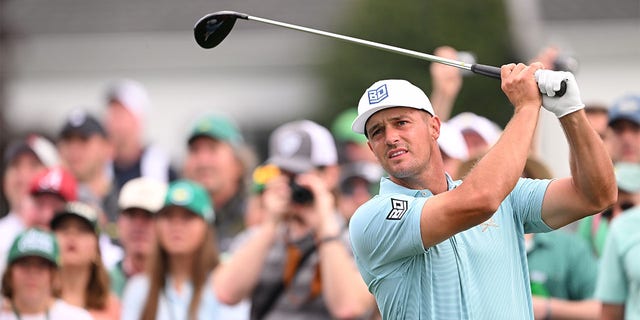 Bryson DeChambeau plays his shot from the first tee during a practice round prior to the Masters Tournament on April 3, 2023.